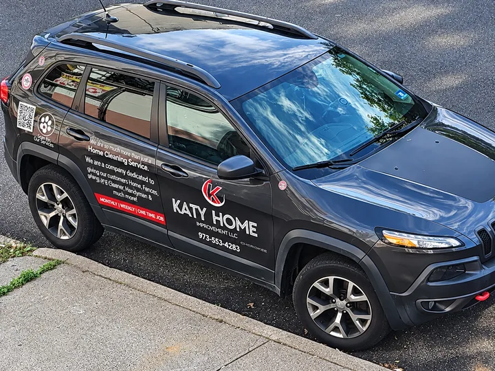 The Katy Home Improvement branded vehicle, parked on a street in Newark