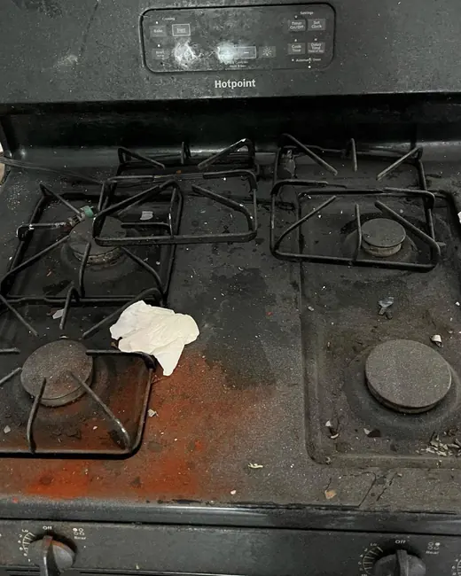 A gas range before cleaning