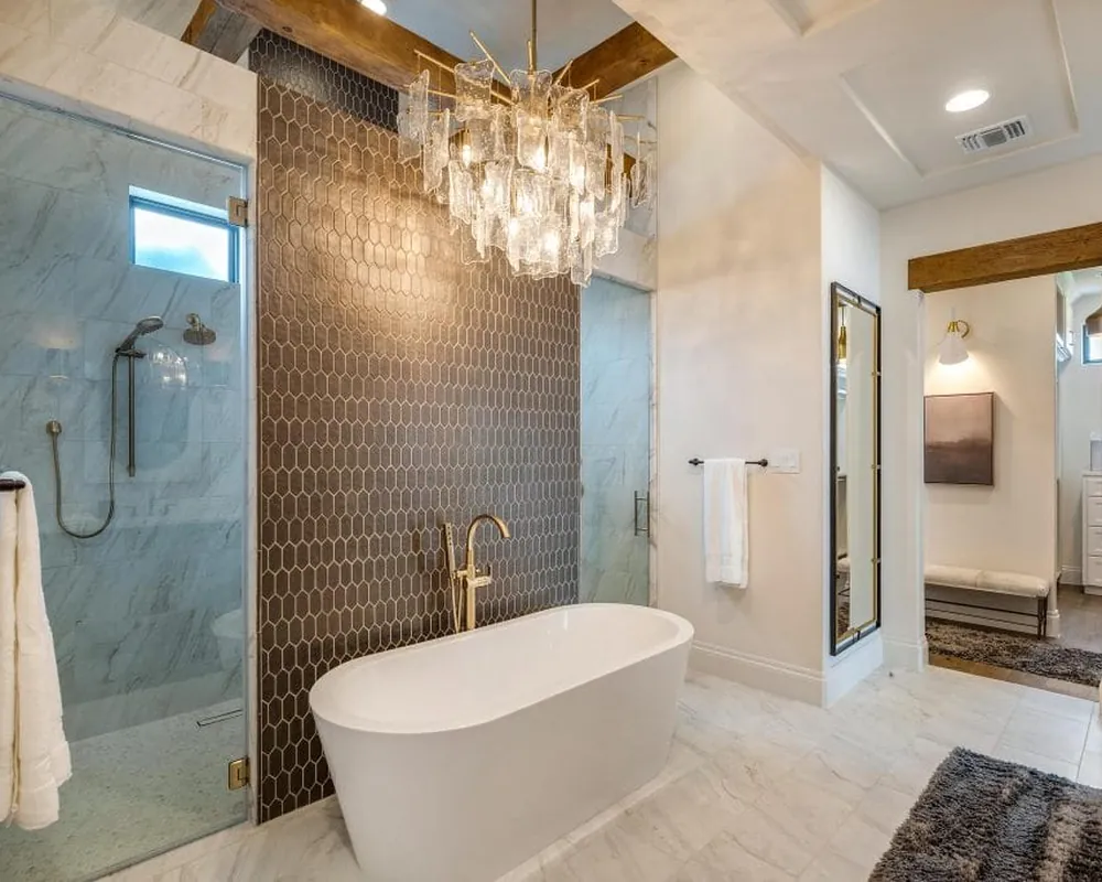 A bathroom after cleaning: tub, glass shower and tile left spotless