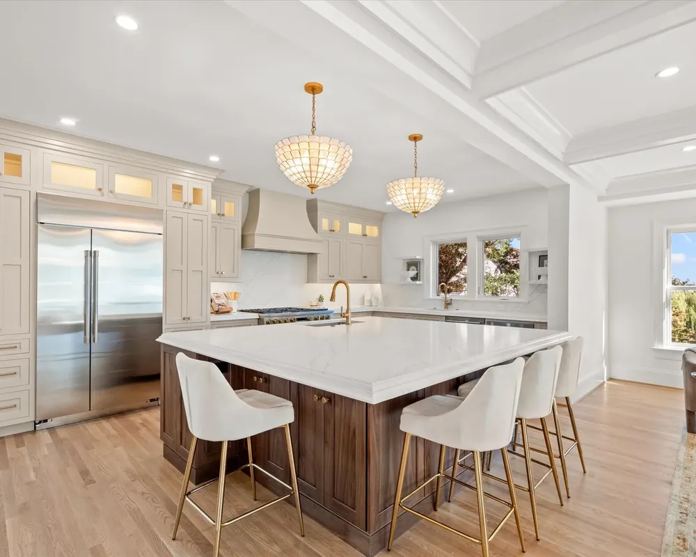 A kitchen after cleaning: island wiped down, counters clear and the floor mopped