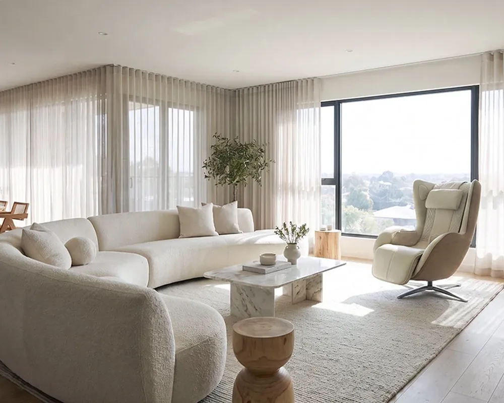 A living room after cleaning: upholstery vacuumed, glass polished and floors done